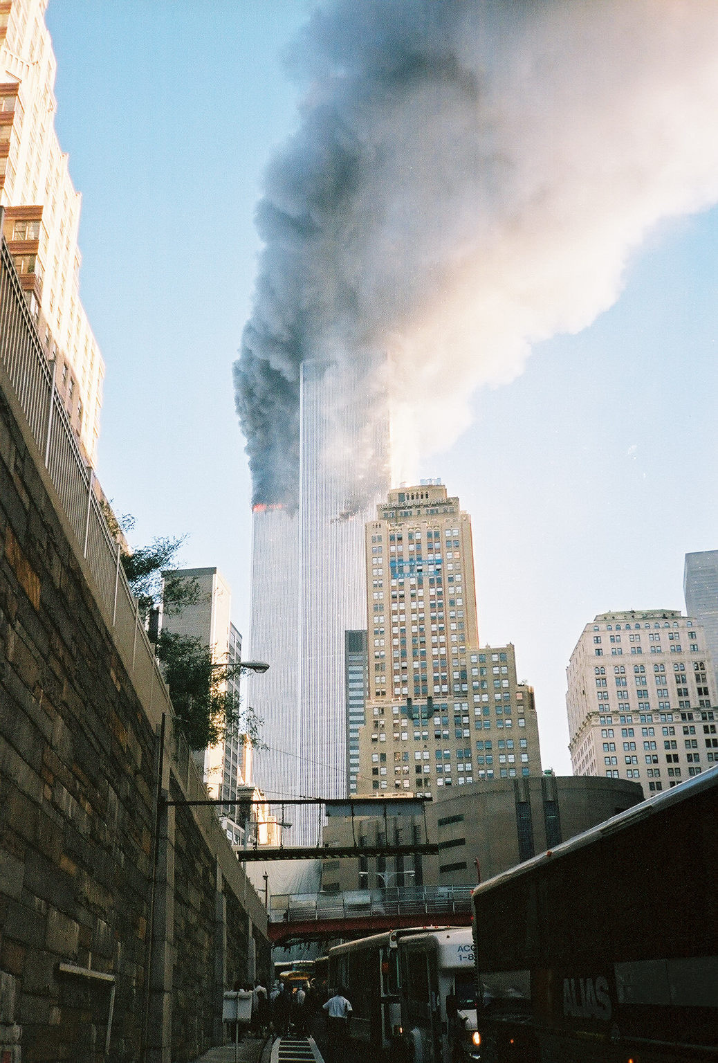 A small flame beginning at the bottom of the hole in the side of the South Tower; the smoke turning black.
